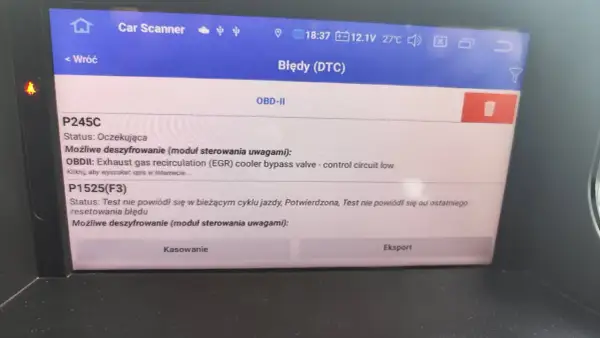 Ekran skanera diagnostycznego pokazuje błąd DTC P1525 w Renault, dotyczący zaworu obejściowego chłodnicy EGR.