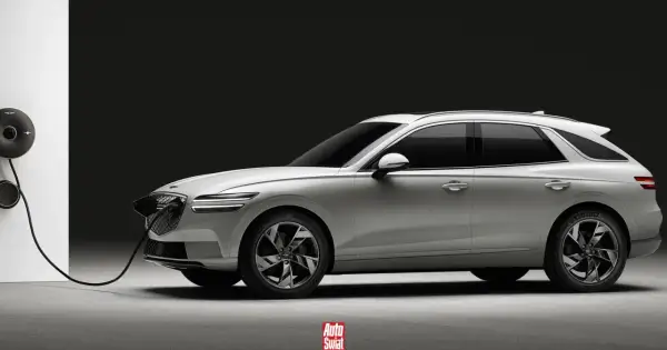 Biały Genesis GV70 na ładowarce. Elegancki SUV z charakterystycznym grillem i podwójnymi światłami.